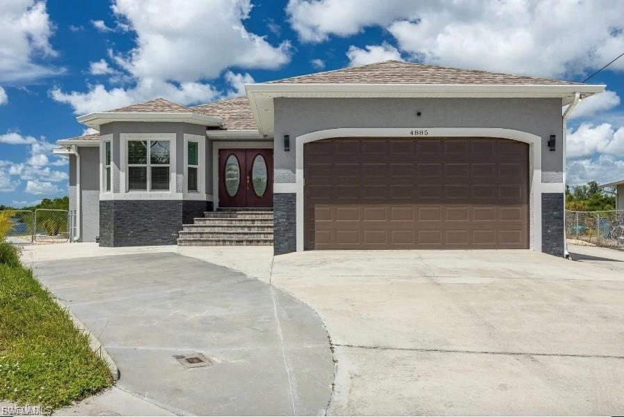 This beautiful 3 Bed 3 & 1/2 Bath riverfront pool home is truly a boater's dream. Enjoy luxury views of the Caloosahatchee River and Beautiful Island from this wide expanse of this tip lot. Perfect spot to watch sunset! Direct Gulf Access! House Was Elevated and Never got any flood damages from previous Hurricanes! Relax in the open floor plan with great room and kitchen attached. The kitchen has an island with sink, beautiful stone counter tops throughout. Solid wood cabinets ,double built in oven, walk in pantry and veggie sink. Reverse osmosis system for sink and double wide fridge. The great room opens to large patio with pavers and 12x24 pool with private half bath. Interior is equipped with plenty of ceiling fans and plantation shutters The Master bedroom has a dual postless sliders that you can fully open and view pool & river. it also has tray ceiling with crown molding. Attached is master bath with dual sinks, jacuzzi tub and separate shower. Stone counter tops included in all bathrooms. Adjacent is a large laundry room with plenty of cabinets. Walk down to private wood dock with a 10,000 pound lift ,water and electrical supply ,and a 158 ft. concrete seawall. Outside the home has gutters over most used areas. A double wide driveway with room for a RV and a 30 amp outlet is ready for your RV to plug in. Don’t miss the opportunity to own this extraordinary riverfront retreat—perfect for those seeking the ultimate Florida lifestyle! CALL TODAY FOR YOUR PRIVATE-SHOWING!