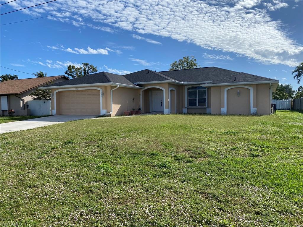 ALL ASSEMENTS PAID AND NOT IN A FLOOD ZONE! All the big-ticket items are in place for the new owner- new 2023 roof, Energy Efficient Solar Panels (WILL BE PAID IN FULL BY SELLER WITH ACCEPTABLE OFFER), Accordion Hurricane Shutter all around, whole house water softener system, 2017 AC system. Almost 1700 sq ft of living space, this spacious 3 bedroom, 2 bath home with oversized 2 car garage and large Lanai! Double door entry with tiled foyer and vaulted ceiling in living area. The kitchen features a big corner pantry, Refrigerator, Dishwasher and Microwave and overlooks the roomy Dining area. Three sets of pocket sliding glass doors open onto the 10' x 26' tiled Lanai. Plenty of room in the rear yard to play, entertain or add a pool. The Master Bedroom features a pocket slider to the Lanai and His & Her walk-in closets, and the adjoining Bath has dual sinks, a garden tub shower combo and private commode. Large indoor laundry room with Washer, Dryer and utility sink. All bedrooms have walk in closets and ceiling fans. Convenient location off Del Prado Blvd, close to shopping, banks and restaurants!