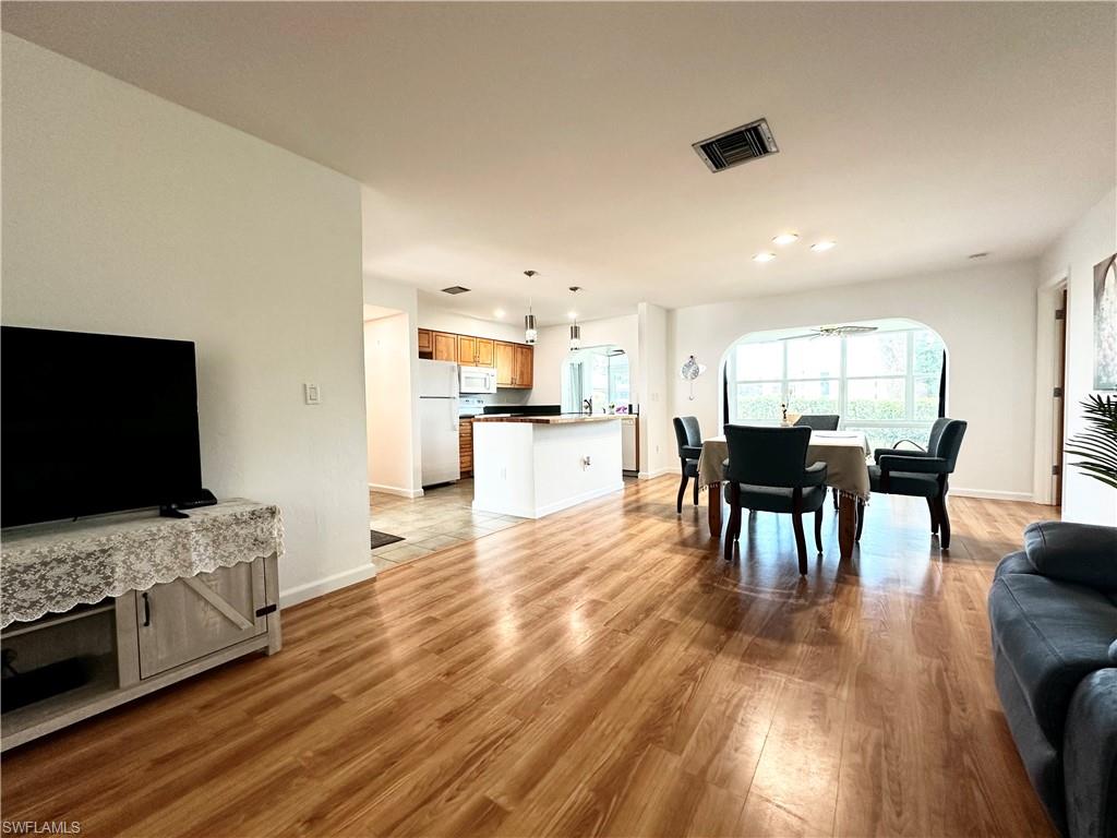 Experience coastal living in this meticulously maintained and move-in-ready 3-bedroom villa, recently refreshed with a full interior repaint and beautiful new landscaping in both the front and back yards. This bright and inviting home features impact-resistant windows, a 8-year-old roof, and a modern open kitchen with a butcher block island, all overlooking a peaceful golf course. Perfectly located for the ultimate Naples lifestyle, you are just 10 minutes from the upscale dining and shopping of 5th Avenue South and only 16 minutes from the world-famous white sand beaches.