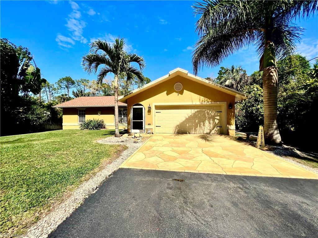 LOCATION, LOCATION, LOCATION! Welcome to your dream home. Property in Collier Woods area conveniently located off Collier Blvd and one block from Pine Ridge Rd. This property is not only in the ideal location but also meticulously maintained. Pride of ownership shows throughout the entire home. Impeccably clean and move-in ready with tons of upgrades and completely remodeled. Tiled throughout, stainless steel appliances, quartzite natural stone tops, custom wood cabinets, full house reverse osmosis, electric hookup for generator, pool with salt water system, chikee-hut with bar, mini fridge and TV, luscious landscaping that feels like a tropical oasis, paved driveway, aluminum shutters, fruit trees and so much more! Too many wonderful amenities to list. You must see this home to truly appreciate its beauty, landscaped grounds and amazing location.