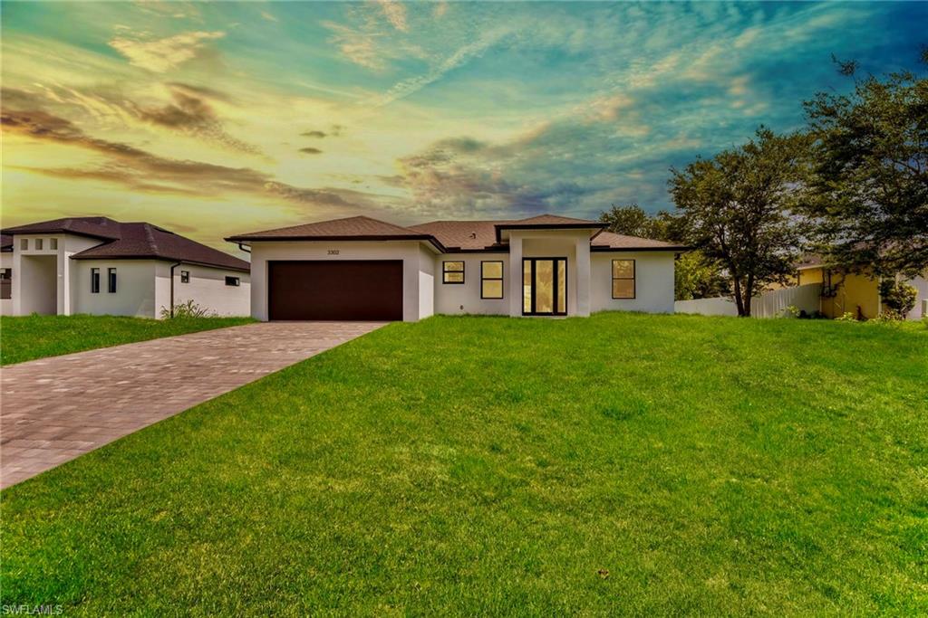 Welcome to this MARVELOUS (2026) BUILT 3/2 + FLEX space home nestled away on a quiet DEAD END street in the highly desirable SW side. This GRAND elevation with a flattering 8ft front door including side lights has a HIGH ceiling & an ideal tiled front porch while spotlighting luxurious OVERSIZED porcelain tile & enticing wood plank flooring throughout, gorgeous QUARTZ countertops & an attractive TILED backsplash with an inviting breakfast bar, STAINLESS STEEL appliances & custom hood, premium fixtures, and admirable illuminated SOFT CLOSE SHAKER cabinets with lazy Susan’s. This awarding floor plan with cathedral ceilings also highlights IMPACT WINDOWS & DOORS,  an impressive SHIPLAP accent wall, masterful casing & window sills, an exceptional TILED walk-in shower with FRAME-LESS glass doors including niches, modern single panel doors, generous WALK-in closet with built-in organizers, and a desirable stand alone dual sink vanity with custom led back lit mirrors. It also features recessed lighting, HIGH SPEED internet, pantry, laundry room under air with refreshing window plus custom shelving with storage cabinets & vanity, whole house gutter system, energy saving spray foam insulation, and an awarding TILED back patio with an appealing tongue and groove ceiling great for entertaining. This property is NOT IN A FLOOD ZONE just minutes from all major amenities & a quick commute to Fort Myers! Schedule your showing today!