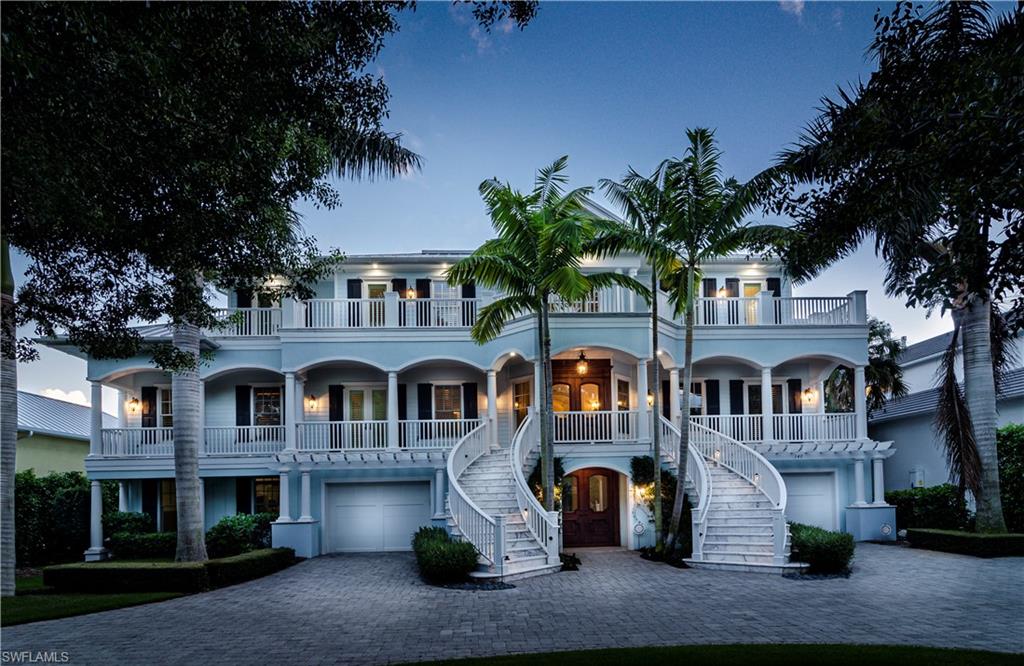H.14005 -Newly staged & $550,000 price drop!! Grande estate in the heart of Old Naples, a block to the beach, 2 blocks from Fifth Ave. S. Offering 5 bedroom suites, over 7500 sq ft of craftsmanship and character with superior molding throughout. Large wrap-around porch leads to the two story foyer with classic details & rich, hand-rubbed hardwood floors. Elevator; elegant staircase. Gorgeous chef’s kitchen features the best appliances, 2 big islands, exquisite marble prep areas, breakfast bar and top quality cabinetry & millwork throughout. Butler's pantry, wine cellar large enough for a connoisseur’s prized collection. An oversized formal dining room filled with natural light overlooks a manicured yard; five fireplaces enhance the many living areas. Master suite is large and luxurious with sitting area, 2 water closets and 2 large walk-in-closets,+ balcony! Handsome library with intricately carved fireplace, floor to ceiling shelves; detailed, coffered wood ceilings. Energy efficient home with solar panels & newer HVAC. Separate guest suite, luxurious heated pool/spa, sun-shelf, plenty of shade for outdoor dining & lounging. Garage is a car enthusiast's dream w/room for 10 cars!!