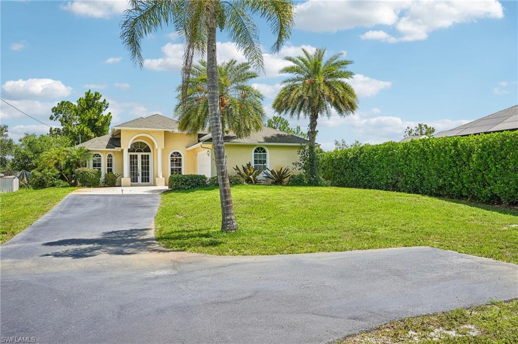Move-In Ready Florida Retreat with Soaring Ceilings & Spacious Living!  Welcome home to this light-filled and beautifully maintained residence offering the perfect blend of comfort, functionality, and Florida lifestyle. From the moment you arrive, you'll appreciate the attractive curb appeal, oversized driveway, and welcoming front entry.
Step inside to discover an open-concept floor plan with vaulted ceilings, and neutral tile flooring throughout the main living areas.  Spacious living and dining areas flow seamlessly together, creating an ideal setting for entertaining guests or enjoying everyday living. The well-appointed kitchen features ample cabinetry, generous counter space, stainless steel appliances (refrigerator less than 1 yr old), and a bright breakfast nook overlooking the backyard. The expansive primary suite serves as a private retreat with plenty of room for a sitting area, primary bath offers dual vanities, a soaking tub, and a separate shower. Large doors open to the outdoor living area - screened lanai to durable composite deck, providing the perfect opportunity to create your own private oasis for relaxing, dining, or enjoying Southwest Florida's beautiful weather year-round. Double car garage with plenty of storage plus outdoor shed provides space to store lawn equipment or bicycles.  Don't miss your chance to own this inviting home that offers space, comfort, and endless potential in a desirable location! An exceptional opportunity for full-time residents, seasonal owners, or investors alike.