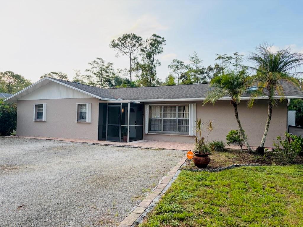 Spacious Naples home on a private 1.14-acre lot in the highly sought-after Logan Blvd area with the rare benefit of no HOA. This 3-bedroom, 2-bath home offers privacy, flexibility, and space for large families, guests, or multi-generational living. Also includes a large private-entry suite. Screened-in pool with expansive deck, abundant parking, and a concrete pad for storage or recreational vehicles. Enjoy the freedom of no HOA fees, assessments, approval requirements, or private association restrictions. Small oven, refrigerator and pantry in the private suite are not part of the sale. 

The home features authentic Saltillo tile and wood flooring throughout. Recent updates include a 50-gallon water heater, pool pump, HVAC system. and security system with three cameras, ring doorbell and floodlight. 

The unique floor plan offers three distinct bedroom spaces (see floor plan for details). The first is a large three-room suite with a private entrance, and includes a kitchenette with sink, counter space, refrigerator, and compact oven, a private bathroom with a large tiled shower, oversized tiled bench, skylights, and two walk-in closets.

The second bedroom is a two-room master suite featuring a walk-in closet, large double closet, and custom built-in TV cabinet. The third bedroom is a 12' x 12' room with wood floors, ideal as a guest room, office, den, or flex space.


Located on beautiful Teak Wood Drive, this property offers a peaceful neighborhood setting where neighbors still wave and look out for one another. A rare opportunity to own a versatile Naples property with acreage, privacy, and the flexibility of no HOA. Small oven, refrigerator and pantry in the private suite are not part of the sale of the house.