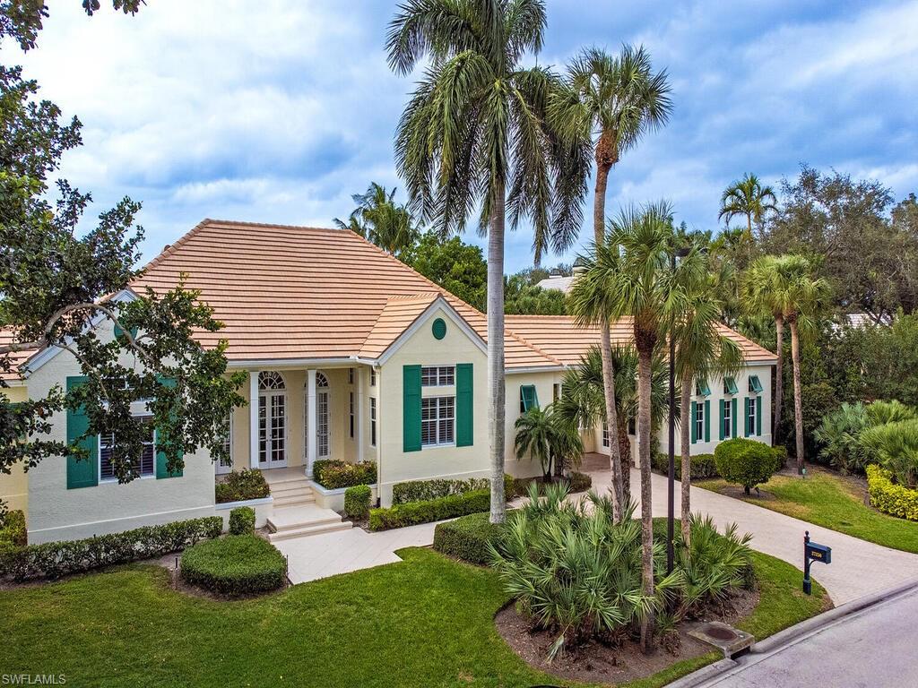 H14084 Elegant Bermuda inspired architecture by award winning architect Dan Summers, AIA, in Ibis Cove, a premier neighborhood within Bonita Bay with a private yet extraordinary lake view. Enjoy fabulous color over the water from magnificent western sunsets.  Four bedrooms, all ensuite, including flexible fourth as an office/study area.  Clive Christian custom kitchen cabinetry, imported from England, with granite countertops.  Crème nova marble floors, imported from Italy. All high-end appliances, Cathedral, warm wooden ceiling in kitchen. Octagonal morning room with wraparound windows and a two-story high ceiling. Gracious Guest House with private lake views, separate from main house, featuring a full living room with cathedral wood ceiling, bedroom and full bath and private entry.  Living & dining area with long private views over pool & lake. Spacious master bedroom with wall of windows providing views of pool & lake. Large lanai with 16 by 36 ft. pool. Porte de cochere & motor court, with large 2 car garage entrance not visible from street. French doors at front & lanai entrances. Plantation shutters & crown molding throughout. New roof 2022. Full "Storm Smart" hurricane protection.