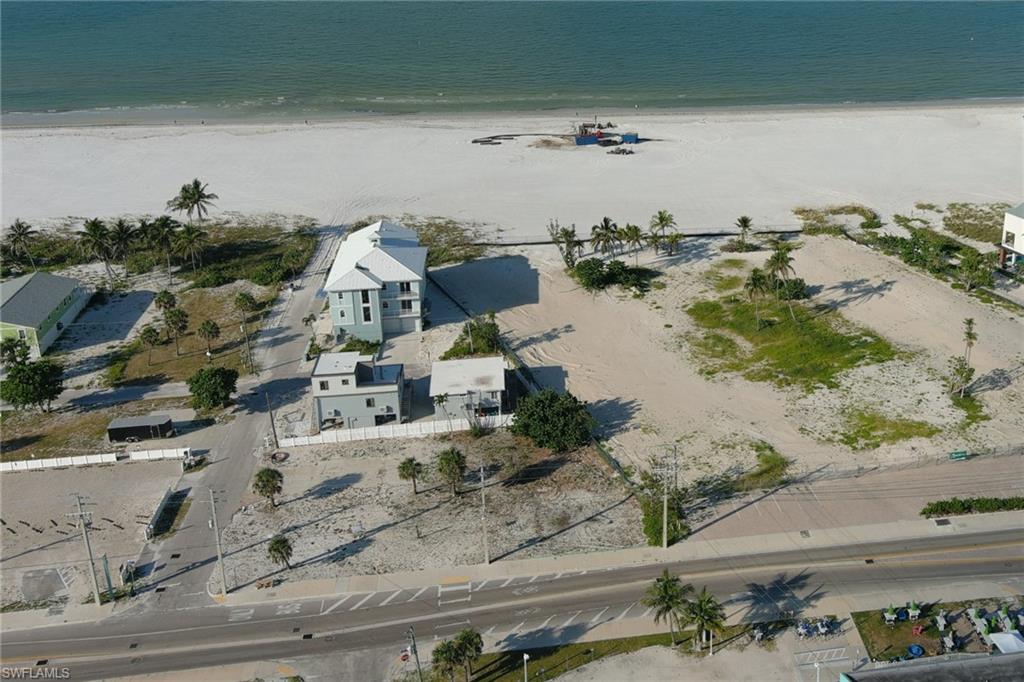 INVESTOR ALERT-REDUCED PRIME GULFSIDE CORNER PARCEL ADJACENT TO A LANDMARK, THE PREVIOUS NEPTUNE RESORT -LOT IS ON THE MANGO ST BEACH ACCESS-Prior to Ian destruction, this parcel had three units on first floor plus three smaller apartments on second floor- This listing to be sold together with 2370 Estero Blvd which is a separate listing-Each lot has their separate tax ID's-Cleared for new construction and a new vision -  Lot is zoned CB for mixed use ,to further expand your vision, an opportunity to add a third cleared adjoining lot 50x150 for sale as MLS #2026010918- Assembling these together would create and envision a  great opportunity with just 140 feet from the sandy beach-Join the rebuild of Fort Myers Beach soon to be the showplace of SW Florida along with our new Times Square and Margaritaville along with our famous sparkling white sandy beach plus memorable sunsets