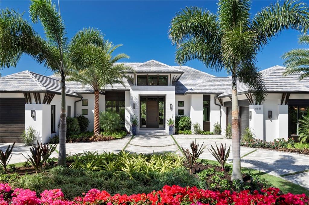 It’s Brand New. Sophisticated. Stylish. This stunning single-story golf course estate home with lake and golf views features the latest in design inspired fixtures and furnishings. Imagine 14’ ceilings with floor-to-ceiling windows. Beautiful architectural millwork, grass cloth wallpaper, wide plank European oak floors, hand knotted rugs, original artwork, and a custom furnishings package by Calusa Bay Design to perfectly complement this striking home. Add 5 spacious, en-suite bedrooms, a private office, 7 baths, 4 open concept living spaces, and a fantastic outdoor great room. All topped off with a stunning 50-foot pool and spa surrounded by gaslight tiki torches, situated in beautiful gated Georgetown on a half acre Western exposure lot. Overlooking the 2nd hole of the Club Course at Pelican Bay, this exceptional award-winning home is featured in the current issue of Florida Design. Amenities include 3 miles of deeded beach with 2 ocean front beach clubs; an active tennis program; 27 holes of golf and more. Brought to you by the dream team of Stofft Cooney Architects, Knauf Koenig Group, and Calusa Bay. Moments from Waterside, Artis-Naples, Mercato, and the Beach.