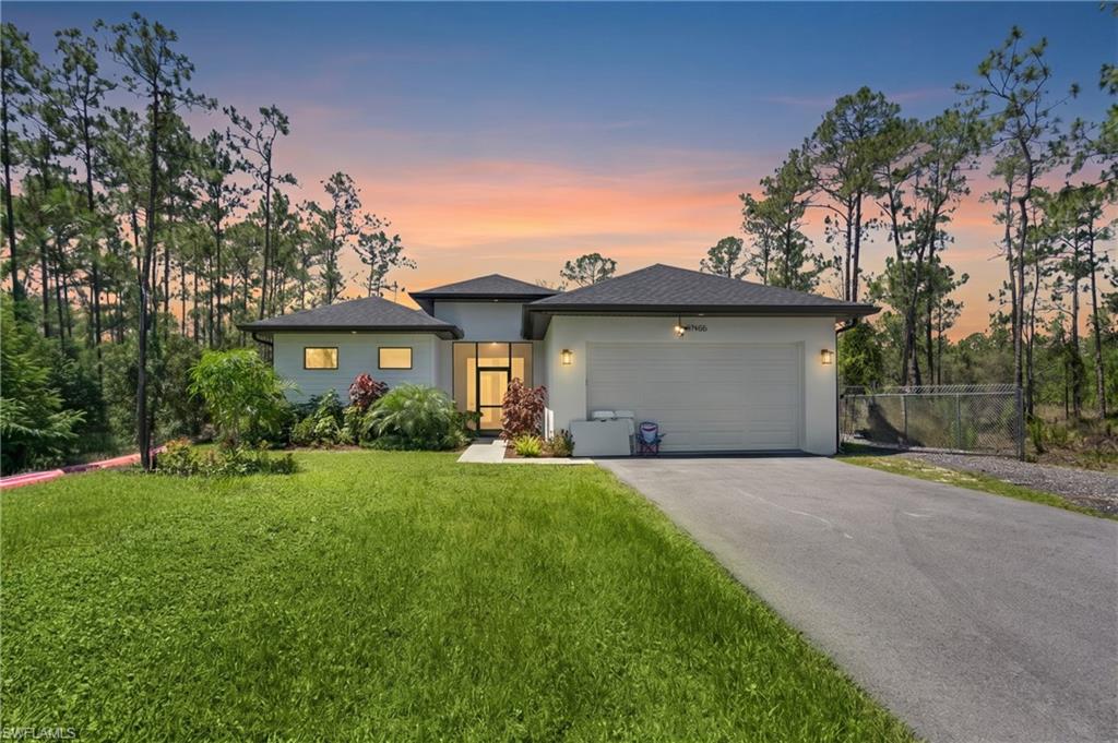 Welcome to your dream home! This stunning new construction sits on 100% upland 1.14 acres and offers the perfect combination of luxury, privacy, and functionality. Featuring soaring high ceilings, an open and modern layout, and a whole-home reverse osmosis water system, every detail was designed with comfort in mind. The property provides plenty of space for trucks, boats, RVs, work equipment, or future additions, with a large portion of the lot already fenced for added privacy and security. A standout feature is the fully finished apartment on the garage, with its own private entrance, ideal for extended family, guests, or generating extra rental income. Additional premium features include a Tesla charging station, providing convenience and efficiency for electric vehicle owners. Enjoy the freedom of estate living while being conveniently located near shopping, dining, and everything Naples has to offer. Opportunities like this are rare.