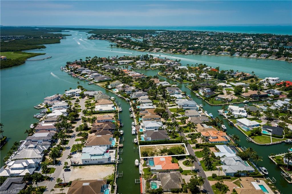 One or more photo(s) has been virtually staged, AI generated or rendered.  Welcome to 2165 Tarpon Road, an exceptional waterfront homesite located in the coveted Royal Harbor community of Naples, Florida. 

As one of the few cleared lots currently available in Royal Harbor — and one of the only lots available on Tarpon Road — this signature 80’ x 135’ property presents a rare opportunity to create a custom waterfront residence tailored to your vision.

Featuring approximately 80’ of canal frontage with direct boating access to Naples Bay and the Gulf, this property offers effortless exploration of Southwest Florida’s stunning waterways. With desirable eastern rear exposure, you’ll wake up each morning to breathtaking sunrises; creating the perfect balance of tranquility and waterfront living.

Venture just minutes from your private retreat to enjoy upscale dining along Fifth Avenue South, boutique shopping on Third Street South, and the pristine white sands of Naples Beach.

Whether you envision classic Florida living in a charming coastal one-story home, or clean and sleek styling in a modern two-story sanctuary, 2165 Tarpon Road offers a blank canvas to bring your dream home — and dream lifestyle — to reality.