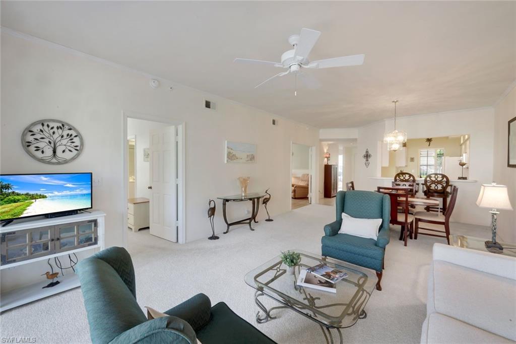 Discover one of the best values in Pelican Landing with this beautifully maintained first-floor end residence in Sawgrass Point, offering abundant natural light, a private view, and effortless Southwest Florida living. This 3-bedroom, 2-bath condo offers 1,552 square feet under air and is turnkey furnished, making it truly move-in ready as a seasonal retreat, full-time residence, or investment opportunity. The desirable first-floor end-unit location provides additional windows that fill the home with natural light, while the private setting creates a peaceful backdrop for everyday living. Relax on the screened lanai and enjoy the coveted western exposure, where colorful Florida sunsets become part of your daily routine. Plantation shutters add timeless style throughout, and the thoughtfully designed floor plan features spacious living and dining areas ideal for entertaining or simply enjoying the Florida lifestyle. Recent improvements include a newer air conditioning system and water heater, providing added value and peace of mind. Additional highlights include a covered parking space, private storage room, ample guest parking, and the added benefit of an X Flood Zone location. One of the most affordable opportunities to own in Pelican Landing, this residence offers an exceptional value and an ideal entry point into one of Bonita Springs' most sought-after gated communities. Residents enjoy world-class amenities, including a 34-acre private beach island, optional golf and social memberships, tennis, pickleball, a fitness center, kayaking, sailing, canoeing, bicycling, miles of walking trails, and an active community lifestyle with a year-around social calendar. Ideally located just minutes from Gulf beaches, Coconut Point, The Promenade, fine dining, golf, and Southwest Florida International Airport, this home offers the perfect combination of location, lifestyle, and value.