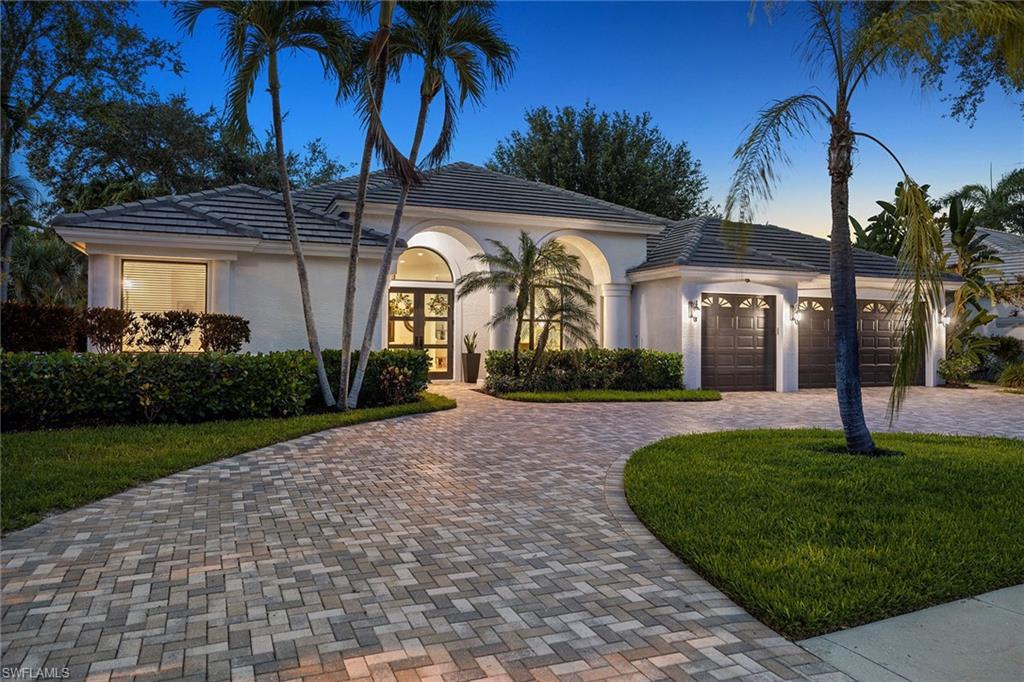 Chic, sophisticated and impeccably renovated, this exceptional whole-home transformation is tucked away on a picturesque lakefront lot on a quiet cul-de-sac street in the heart of Monterey. Wide-plank white oak flooring flows throughout this open concept layout, adding warmth and timeless elegance to the home's transitional design. At the heart of the home is a stunning chef’s kitchen featuring a massive Taj Mahal Quartzite island, premium JennAir Noir Series stainless appliances, including an induction cooktop and hood, a warming drawer, exceptional lighting and a fabulous hidden walk-in pantry. The kitchen seamlessly opens to a sun-drenched family room highlighted by an inviting fireplace and a stylish shiplap accent wall. Designed for everyday living and entertaining, the dining room showcases a gorgeous built-in buffet with sparkling Cristallo countertop and integrated wine cooler and mini refrigerator. Every bath has been thoughtfully appointed with the finest materials and finishes. Fabulous outdoor living overlooking the lake with 12-foot ceilings on lanai, stunning stone deck, renovated pool and spa, and extended picture frame pool enclosure (2026). The luxurious owner's retreat features a bright, spa-inspired bath with walk-in shower, dual vanities with Taj Mahal quartzite counters, a soaking tub and a generous custom walk-in closet with built-ins. Beyond the extensive renovation, the home offers a newer roof (2021), HVAC system (2022), PGT impact windows and sliders (2024) and fabulous impact front doors (2024). Additional highlights include 12-foot ceilings, new 8-foot shaker interior doors, new baseboards and casings, air conditioned three-car garage, well irrigation, walkway around home and a paver circular driveway. Furnishings are negotiable. Monterey remains one of Naples sought-after guard-gated communities, known for its resort-style amenities and prime location just three miles from the beach. Residents enjoy easy access to Mercato and Waterside Shops, both just a short bike ride. Community amenities include three Har-Tru tennis courts, pickleball courts, a fully equipped fitness center, a full basketball court, heated lap pool, a shaded playground and a vibrant social calendar throughout the year. Top-rated public schools are nearby, along with several outstanding private school options.