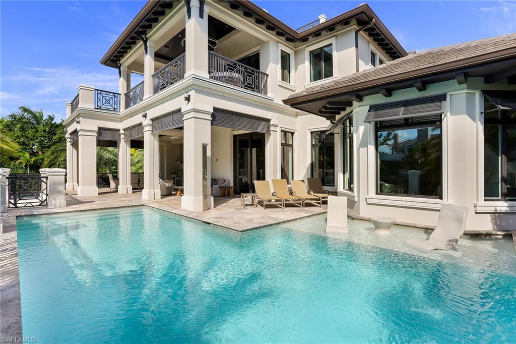 One-of-a-kind new construction home with Gulf views. This custom-built home is located only two blocks from 5th Ave and one block to Naples' white sandy beaches. Every detail in this home is over the top, from the gourmet kitchen with Sub-Zero and Wolf appliances to the large outdoor entertaining area with pool, spa, kitchen and gas fire pit. Two master suites, 3 guest bedrooms all with en-suite baths, large loft with wet bar and balconies from the second floor. Step outside the upper balcony to the custom spiral staircase that leads you to the travertine rooftop with approx. 3,500 square feet and views that will blow you away. Smart home technology throughout to control almost every aspect of this home from your phone. Curated and handpicked interior furnishings with custom art and Swarovski crystal lighting and chandeliers.
