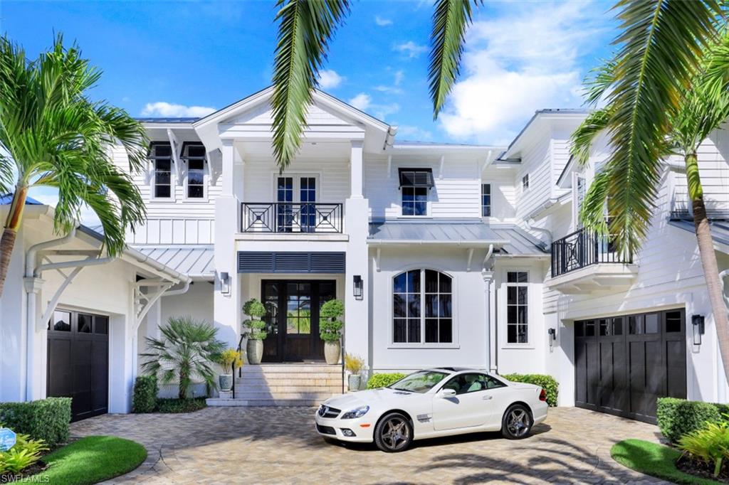 H4240 - Conceived by Calusa Construction with an interior design concept by Bruce Palmer Coon. Step into the Florida style with a cozy elegance and thoughtful layout that covers all you will need to step away!  Starting with 5 bedrooms and 6 and a half baths, separate wine lounge, office and billiard room, 3 laundry facilities and located on an avenue lined with homes built with luxury in mind. This home will surround you with comfort and appointments found only in Naples best properties. Have it all! From the light filled common spaces to the intimate feel of each individual suite. Just a look announces the effort to make perfection a reality. The double lanais and outdoor spaces offer all you could want  to remain engaged and satisfied.  The dockage is a superb reflection of the boating and outdoor living you would expect.  Firepit, outdoor kitchen and dining, docks for all the toys and the masterful COVERED cut-in boat slip with 13,000 lb lift and a smaller water toy 7000 lb lift next to a lap pool and spa that will hypnotize . Located within walking distance to third Ave shops and restaurants. All this is offered FURNISHED with few exclusions. Move in and immediately enjoy Paradise!