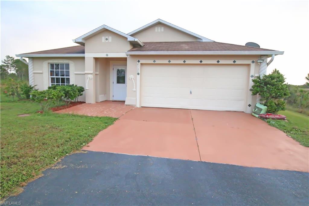 BEST DEAL in all of Golden Gate Estates. It wont last at this price. Make sure to come see this home today before it's gone. The beautiful Naples Florida sunset photos were taken from the backyard of this home. New laminate flooring, New water system, Stainless Steel appliances, Full side front loader washer/dryer & the list goes on. Property has 4 Bed, 2 Bath & a 2 car garage, pave driveway, Professional basketball Hoop. Sellers are waiting to hear from you. Don't delay and come see this home right away.