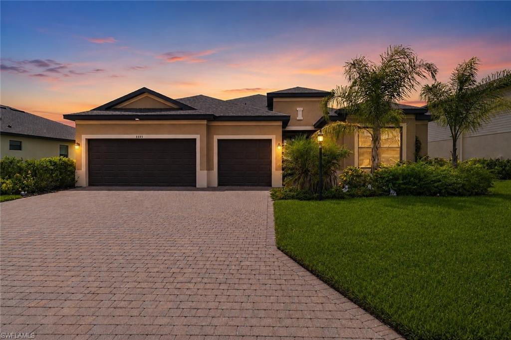 Welcome to refined Florida living in the highly sought-after gated community of Portico. This exceptional Summerville floor plan offers 3 spacious bedrooms, 3 full bathrooms, a private office/den, and an oversized 3-car garage, thoughtfully designed to blend luxury, comfort, and functionality. From the moment you enter, you'll be captivated by the home's elegant open-concept design, highlighted by upgraded tile flooring, abundant natural light, and sophisticated finishes throughout. The gourmet kitchen is a true centerpiece, featuring rich granite countertops, stainless steel appliances, ample cabinetry, and a generous island perfect for both everyday living and entertaining. The expansive great room seamlessly flows to the outdoor living area, where breathtaking long lake views create a tranquil setting. With desirable western exposure, you'll enjoy spectacular Florida sunsets painting the sky each evening from the comfort of your own backyard. Designed with today's lifestyle in mind, this residence is equipped with Smart Home technology, including a Ring doorbell system and MyQ smart garage access, providing enhanced convenience, connectivity, and peace of mind. The luxurious owner's suite serves as a private retreat, complete with serene water views, an elegant en-suite bath, and a spacious walk-in shower designed for relaxation and comfort. Residents of Portico enjoy an impressive array of resort-style amenities, including a community clubhouse, fitness center, lap pool, resort pool, tennis courts, pickleball courts, basketball courts, playground, and scenic sidewalks throughout the neighborhood. A favorite community tradition, "No Cook Mondays," brings neighbors together with rotating food trucks at the amenity center, creating a vibrant and welcoming atmosphere. Perfectly positioned in one of Fort Myers' most desirable communities, this remarkable home offers the ideal combination of luxury, convenience, and an active Florida lifestyle. Experience lakefront living, breathtaking sunsets, and exceptional community amenities—all from the comfort of your new home.