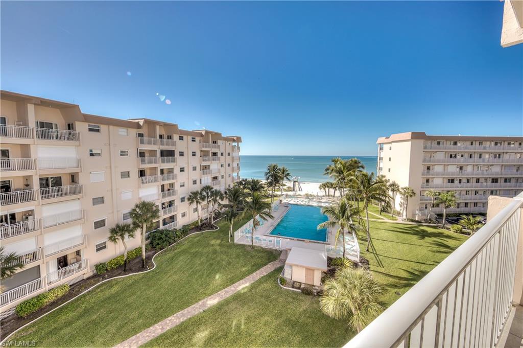 Great LOCATION View of  the Gulf of Mexico from your balcony and owner's suite!!! View of large heated pool and well maintained, manicured lawn & landscaping. Updated owners en-suite bath with ez walk in shower. Walk right across the street to Santini Plaza with boutique shops, good restaurants and a couple blocks away 4 screen movie theater!! Farmers market on Tuesday and Thursday mornings! Close to Lovers Key State Park and down the road, Bonita beach and Naples. Includes one year American Home Shield Warranty. Sold Turn Key!