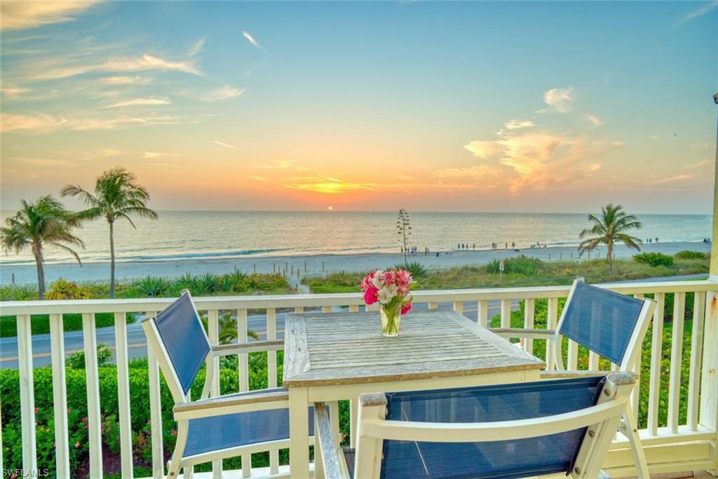 An exceptional gulf to bay offering within the low density complex of only five units which enjoy 1.5 acres of lushly landscaped grounds along with 365 ft of gulf frontage and direct access boating via the private community dock, with a short idle time. This townhome is finely appointed with a myriad of jovial tropical colors that reflect the island environment. The open living space allows for two lounging areas along with a large dining table. Could be converted to a 4 bedroom if desired. You will find two decks that overlook the gulf waters along with two decks focusing on the beautiful gardens. An exceptional gulf to bay offering within the low density complex of only five units which enjoy 1.5 acres of lushly landscaped grounds along with 365 ft of gulf frontage and direct access boating via the private community dock, with a short idle time. This townhome is finely appointed with a myriad of jovial tropical colors that reflect the island environment. The open living space allows for two lounging areas along with a large dining table. Could be converted to a 4 bedroom if desired. You will find two decks that overlook the gulf waters along with two decks focusing on the beautiful gardens.  This home is just 25 steps to the sandy beach, and is walking distance to all the Village shops and restaurants. An exceptional rental performer with $232,000 in gross rental revenue for 2021.