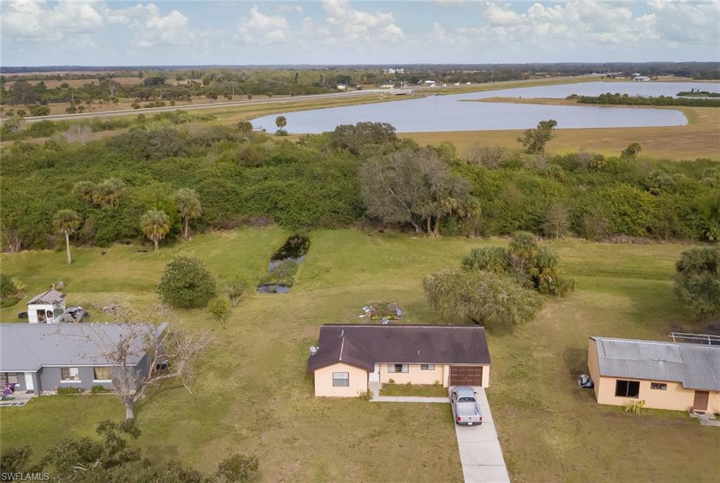 Darling 2 bedroom 1 bath home on a beautiful and private 1/4 acre lot that backs up to a greenbelt area. Featuring tile flooring throughout the home and an updated bathroom. $180 a year HOA includes usage of a seasonal community pool area. By Appointment only!