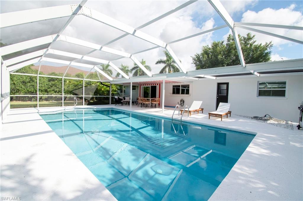 Welcome to 59 Wickliffe Drive, a beautifully maintained pool home in the highly desirable Willoughby Acres community of North Naples. Perfectly positioned on an oversized lot with no HOA fees or rental restrictions, this residence offers the flexibility of a primary residence, seasonal retreat, or income-producing investment property.

Designed for the Southwest Florida lifestyle, this three-bedroom, two-bath home features an open and inviting floor plan with tile flooring throughout, creating a seamless flow between living, dining, and entertaining spaces. 
Step outside to your private backyard oasis where a spacious screened lanai and sparkling pool create the perfect setting for year-round outdoor living. Whether enjoying your morning coffee, hosting family gatherings, or relaxing after a day at the beach, this outdoor space was designed to be enjoyed.

Recent improvements, including a newer roof in 2022 which provides peace of mind and the recently renovated bathrooms enhance the home's move-in-ready appeal. The generous lot offers ample space for pets, gardening, recreation, or future enhancements.

Located in the heart of North Naples, Willoughby Acres remains one of the area's most sought-after neighborhoods due to its convenient location, A-rated school district, and lack of HOA restrictions. Residents enjoy quick access to world-class beaches, Mercato, Waterside Shops, fine dining, shopping, entertainment, golf courses, and Interstate 75. Vanderbilt Beach, Delnor-Wiggins Pass State Park, and the vibrant Naples lifestyle are all just minutes away.

Whether you're searching for a full-time residence, vacation getaway, or investment opportunity, 59 Wickliffe Drive delivers the perfect combination of location, lifestyle, and value in one of Naples' most established communities.