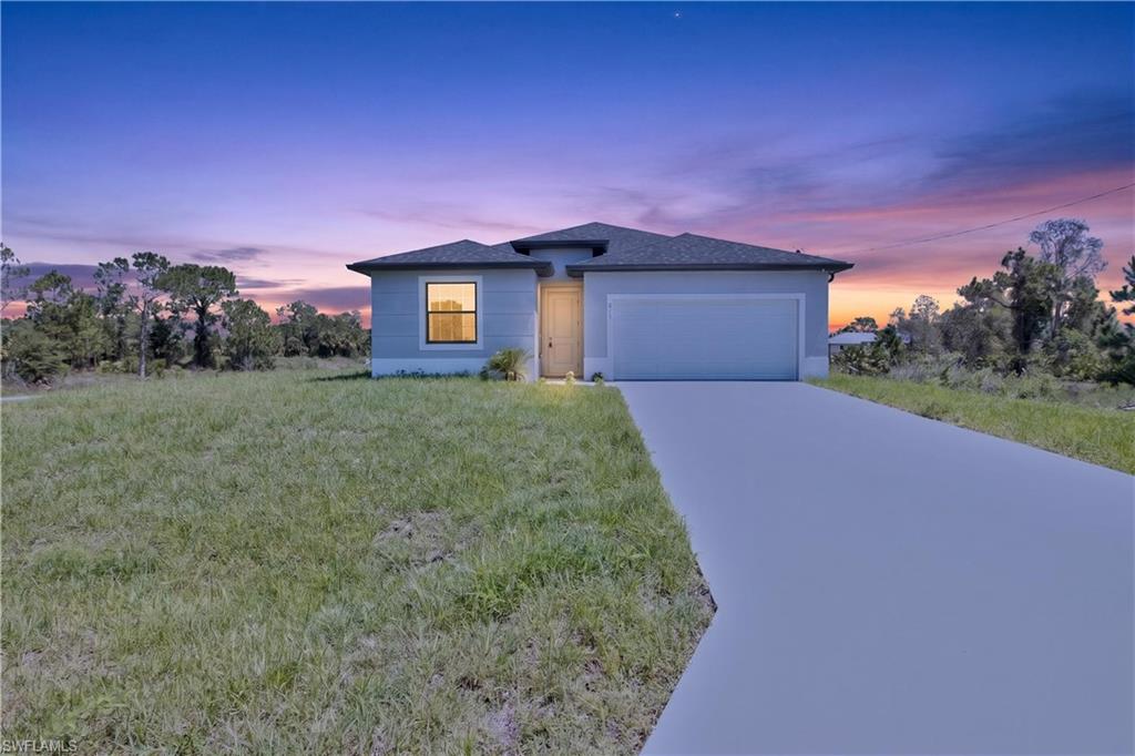 Discover this brand-new 4-bedroom + 3-bathroom home designed for modern living and flexibility. The open-concept layout creates a bright and inviting space, perfect for families and entertaining alike. The chef’s kitchen stands out with quartz countertops, a large center island, wall oven, sleek cooktop with a wall-mounted pyramid hood, custom cabinetry, and stainless steel appliances. The spacious primary suite offers a private retreat with a double vanity, quartz counters, and a walk-in glass shower. Additional highlights include impact-resistant windows and doors, a 2-car garage, abundant natural light, and a builder’s warranty of up to 10 years. The oversized backyard offers plenty of space to create your ideal outdoor living area or add a future pool. Located in a peaceful and growing area of Lehigh Acres, this move-in ready home combines comfort, style, and opportunity, perfect for homeowners and investors alike.