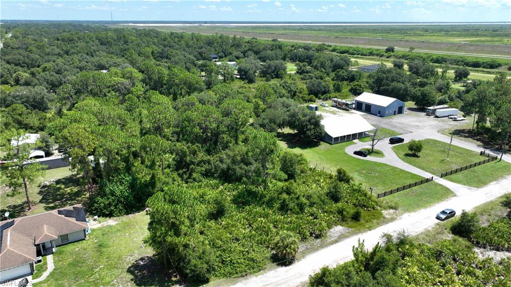 Escape to the quiet charm of Wheeler Estates with this 1.25-acre residential lot in Hendry County. Tucked among surrounding acreage properties, this parcel offers a peaceful rural setting with mature trees already in place, creating natural shade, added privacy, and a beautiful head start for a future homesite. Zoned RR-WE, the property offers room for a single-family home, outdoor living space, accessory structures, gardens, or simply the extra elbow room that makes country living so appealing. Enjoy the privacy and slower pace of rural living while still being within reach of LaBelle, Alva, and nearby amenities. Buyer to verify zoning, building requirements, flood zone, utilities, and intended use with Hendry County.