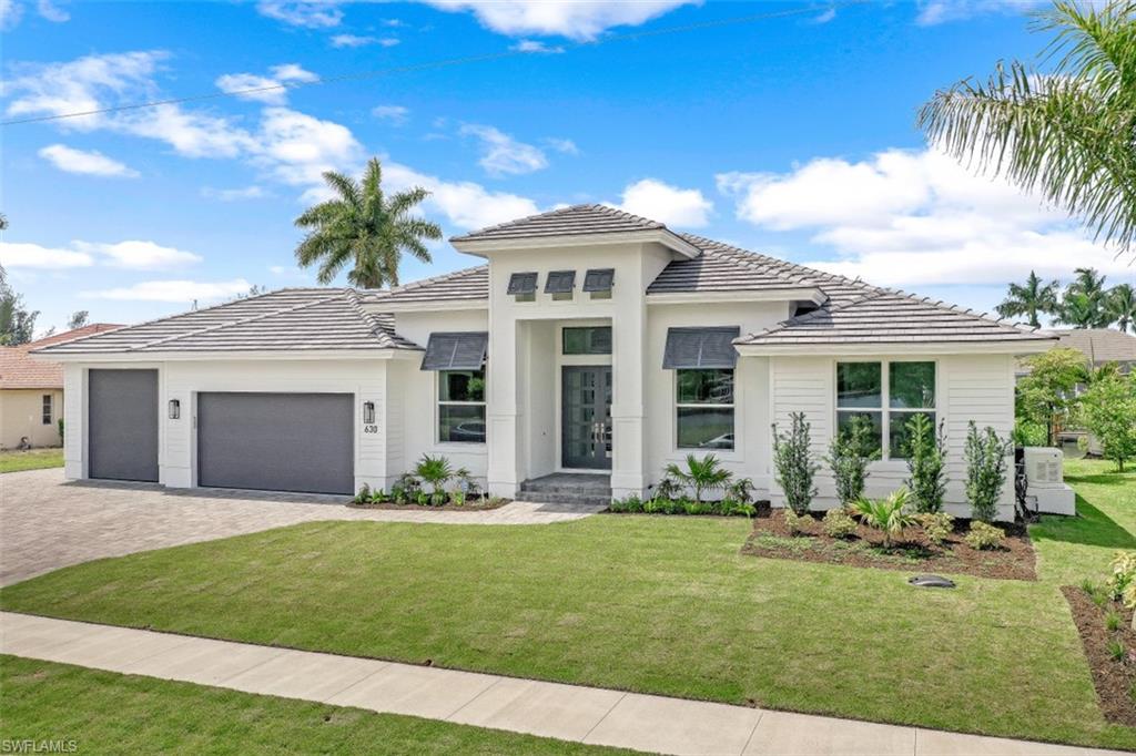 Come see this Move In Ready, spectacular highly customized brand new build in the Tigertail beach area, on a quiet street . Water Direct.  
This fully furnished designer home is available now to the discriminating buyer!
Ceramic tile throughout this graciously appointed 6 bedroom home with 5 1/2 baths  (currently set up as a 4 bedroom plus den, plus office).
A whole house generator, a safe room, smart security and smart 4 zone AC, central vac, and high ceilings everywhere are just some of the features of this fabulous home.
The three car oversized garage has rear doors that open to a paved area behind the house perfect for jet ski trailers or additional toys. One door is extra tall, to accommodate a boat on a trailer or possibly an RV or larger vehicle. The pool area features panorama screens and a sun ledge. Beautiful landscaping with a waterside patio.
There is a huge custom dock with lift (16000lb's) and a separate elevator platform lift (7000lb's) currently set up for 2 jet ski's. The location offers a quick out through Smokehouse Bay into the Gulf of Mexico with no fixed bridges.
Just moments away from the Esplanade, shopping, dining, and Tigertail beach.