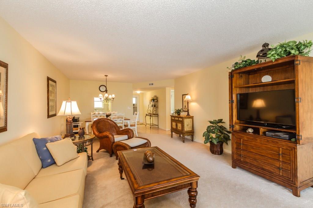 Wonderful light and bright condo in 55+ community. Offered furnished , this lovely home overlooks the pool/club area and is peaceful and quiet.  The large lanai is perfect for relaxing and has electric storm shutters for added protection when you leave. There are hurricane windows and the building had a new roof in 2005. The home has a washer and dryer, a spacious guest room, and plenty of room to entertain guests in the living/dining room.  The Master Bathroom was re done in 2005 with a new shower and vanity.  The condo is rented for February and March 2018 and the lease must be honoured by the buyer.  This great condo is ready for you and is conveniently located near local shops, restaurants, and easy access to Olde Naples and the Beaches. NO SHOWINGS 2/16-2/23/18. Sorry.