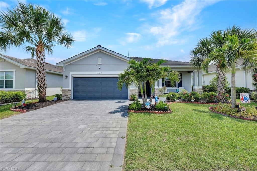 Welcome to this like new Venice floor plan, built in 2023, offering 3 bedrooms, 3 full bathrooms, and a spacious open concept design with beautiful lake views. Move-in ready and meticulously maintained, this home combines modern finishes, thoughtful upgrades, and resort-style living in the highly desirable Orange Blossom Ranch community. Step inside to discover tile flooring throughout the entire home. The spacious kitchen is the heart of the home, featuring a large center island, quartz countertops, updated modern backsplash and a new Bosch dishwasher. The kitchen opens effortlessly to the family room and dining area, making it ideal for entertaining and everyday living. The split-bedroom floor plan provides privacy for family and guests, with each bedroom conveniently located near a full bathroom.  The primary offers a private retreat complete with two walk-in closets, dual vanities with quartz countertops, and an oversized walk-in shower. Large sliding glass doors fill the living space with natural light and lead to the generous screened lanai, where you can relax and enjoy peaceful lake views. The spacious backyard offers plenty of room to design and build your dream custom pool, creating the perfect outdoor oasis for entertaining, relaxing, and enjoying Florida living at its finest. Additional upgrades include a functional laundry room with added storage cabinets and an extended granite countertop for folding and workspace, a retractable front screen door for enjoying refreshing cross breezes, an automatic garage screen door that transforms the garage into a versatile bug-free flex space, and pull-down attic stairs providing convenient access to additional storage. The two-car garage and numerous storage enhancements make this home as functional as it is beautiful. Residents of Orange Blossom Ranch enjoy exceptional resort-style amenities, including resort and lap pools, a spa, fitness center, tennis courts, basketball courts, sand volleyball, fishing piers, playgrounds, and a clubhouse offering year-round social activities. Conveniently located in Northeast Naples, just steps from the new Publix shopping center, dining options, public golf courses, and top-rated schools. This better than new home offers the perfect combination of comfort, convenience, and Florida lifestyle!