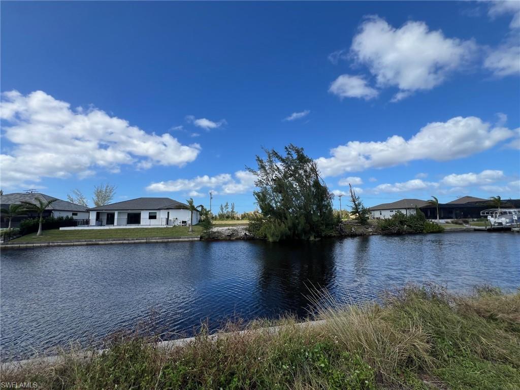 This is the piece of real estate you’ve been looking for! A Great Opportunity to Start Building your Dream Home now! With a 10’ Seawall, vs. the standard 8’ already in place, you have extra protection from any possible sea surges, you will save time and money building your Family's Dream Home! (It can take 6 months to one year to get a seawall approved and built!) Talk about a prime location - The future $1B development project which includes Gulf Gateway Resort and Marina Village, 7 Sisters Island Development is slated to break ground in 2026 and will bring high end amenities and thus increased services to the area, as well as walking distance to Tropicana Park currently under construction which includes a beach, kayak launch, boat tie up, playground, etc.! From this location atop the 100'-Wide SIRUS CANAL, you can immediately appreciate watching the gorgeous Florida sunsets from your pool deck facing this West, Rear Exposure Home site! This tranquil location offers quick, convenient, Gulf-access boating via the North Spreader Waterway! Many new luxurious, impressive homes are being built in this area and on this great cul-de-sac which lends itself to limited traffic! This lot is nestled in the middle of continued growth while still offering the close proximity to the Cape Coral area's already established shopping and dining! Save time and money by selecting this lot with a 10’ seawall and begin building the home of your dreams and living the SW Florida Lifestyle today!