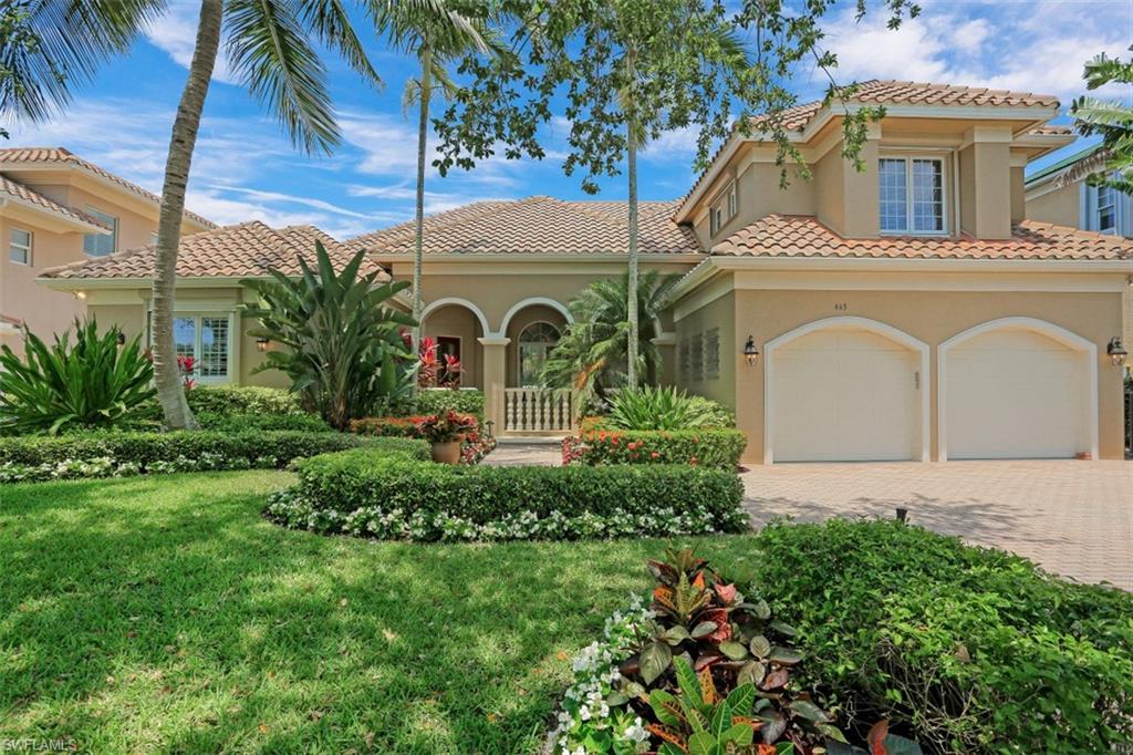 Paradise Found. This luxury 4BR canal front home offers a front verandah to enjoy a lush tropical oasis. Open concept floor plan with lots of natural light and multiple options for entertaining, with an updated large kitchen with quartz countertops, accented backsplash, new Wolf/Jennair/Miele/GE appliances, tile flooring throughout, pantry closet, and two wine refrigerators & butlers bar. Bathrooms have modern finishes plus the home includes floor-to-ceiling sliding doors to the lanai and an electric fireplace in the family room, this partially furnished home is move-in ready. The first floor master suite has a luxury en-suite bathroom, jetted tub, dual sinks, multiple closets, and access to the outdoor lanai. A beautiful hardwood staircase leads to the second floor guest wing with two bedrooms and an updated bathroom with deep soaking tub. There is plenty of storage, laundry room with utility sink, additional storage closet, and second refrigerator for all your entertaining needs. In a private setting with covered boat dock and fish cleaning station, boaters have easy access to the Gulf of Mexico and an outdoor grill area leads to the dock. Experience Luxury and Privacy!
