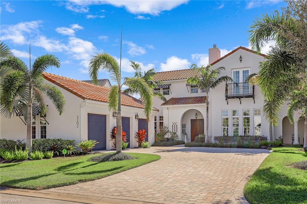 Set in Fiddler Creek's award-winning Marsh Cove in Naples, this spectacular two-story residence is one of the finest custom-built homes in all of Fiddler’s Creek. Designed and built by Ashton Woods with numerous custom upgrades and abundant luxury finishes, it's offered turnkey furnished with its own dock and oversized air-conditioned garage. This is an entertainer’s paradise, with a gourmet kitchen and enormous lanai allowing for an easy flow between the indoor and outdoor areas. Bathed in natural light by French doors and high windows, your living room showcases magnificent water and preserve views. The main floor primary suite features a huge shower, two walk-in closets and classic marble highlights. The kitchen exceeds gourmet standards with high-end appliances, a stunning rock wall, and elegant countertops and cabinetry. The upstairs features breathtaking water and sunset panoramas from a large balcony, 2 inviting guest bedrooms and a loft family room. Outdoors, your expansive screened lanai faces southwest and includes a resort-style pool and spa with water features, an outdoor kitchen, and a fire pit. A must-see luxury one-of-a-kind home within a premier community.