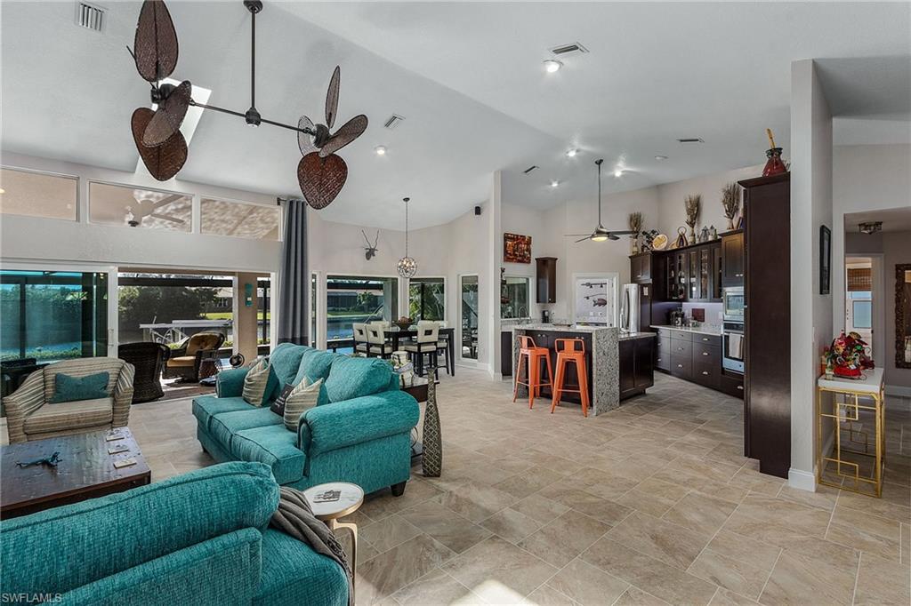 Location, location, location, welcome to paradise! Move right in to this fabulous, South facing Gulf access home on a spectacular 200' wide “Miranda Canal”, in one of the prettiest parts of SW Cape Coral. This home boasts contemporary Voluminous Design with a WOW FACTOR as soon as you walk through the front door, one looks through expansive glass across paver lanai & pool to wide water canal views. This completely remodeled home includes: New flooring, trim and paint inside & out. New kitchen, wood cabinets with stainless steel appliances, induction cooktop, touchless kitchen faucet, waterfall quartz countertops.  New bathrooms, with walk in showers, custom vanities and standalone tub. Large extended panoramic pool cage with picture windows, pavers & solar heater, Custom outdoor kitchen with decorative vent hood.  New 4 ton a/c unit. 10k boat lift, TREX captains walk and wrap around dock. Impact windows and sliders.  Paver driveway. All indoor furnishings are negotiable.