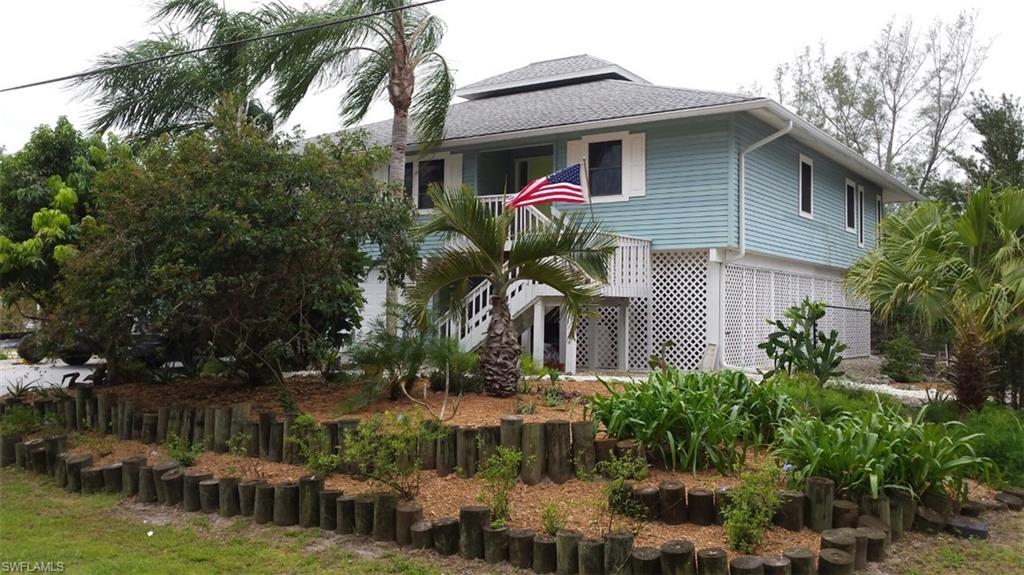 Deep water Gulf Access 3 bedroom 2 bath home with an office off the master bedroom. Wide open floor plan, screened lanai with view of the mangroves, covered 8 000 lb boat lift, cement patio and art studio/workshop enclosed below. This home has it all: tile floors throughout, double hung impact windows and garage doors installed in 2017. Mature drought resistant landscaping, 12' pocket slider, new A/C 2017.