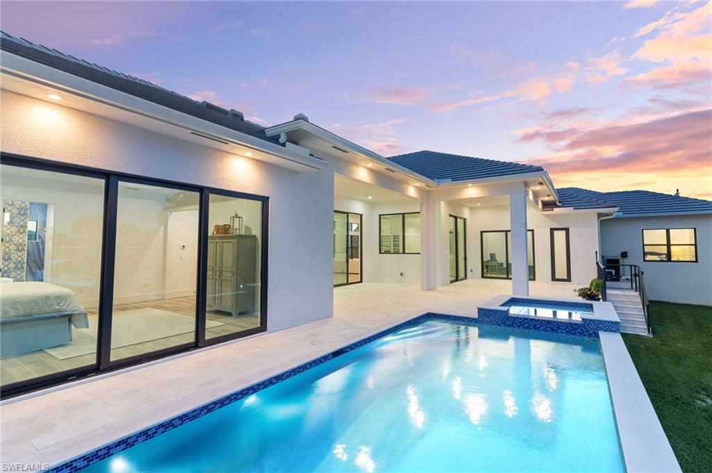 Unwind in waterfront luxury in this 5-bedroom, 3.5-bath masterpiece built in 2023 at 295 Landmark, Marco Island. Located on an oversized corner lot in the heart of Marco Island, this custom-designed home boasts an abundance of natural light, creating a welcoming ambiance throughout. Indulge in the indoor-outdoor lifestyle with a private lanai that seamlessly connects to the expansive living spaces. The meticulously crafted residence offers everything new, from modern finishes to a stunning kitchen featuring white granite countertops, luxury plank vinyl flooring, exquisite white cabinetry, and a fully plumbed Miele coffee system. Simply add your favorite beans and enjoy everything from a perfect cup of coffee to a frothy latte at the touch of a button. Step outside onto your private lanai and enjoy the stunning private pool with remote-controlled lighting that overlooks the canal. With quick access to the beach, just half a mile away, and close proximity to popular restaurants, this home offers the perfect blend of both relaxation and entertainment. Discover the ultimate Marco Island lifestyle where coastal living meets modern elegance.
