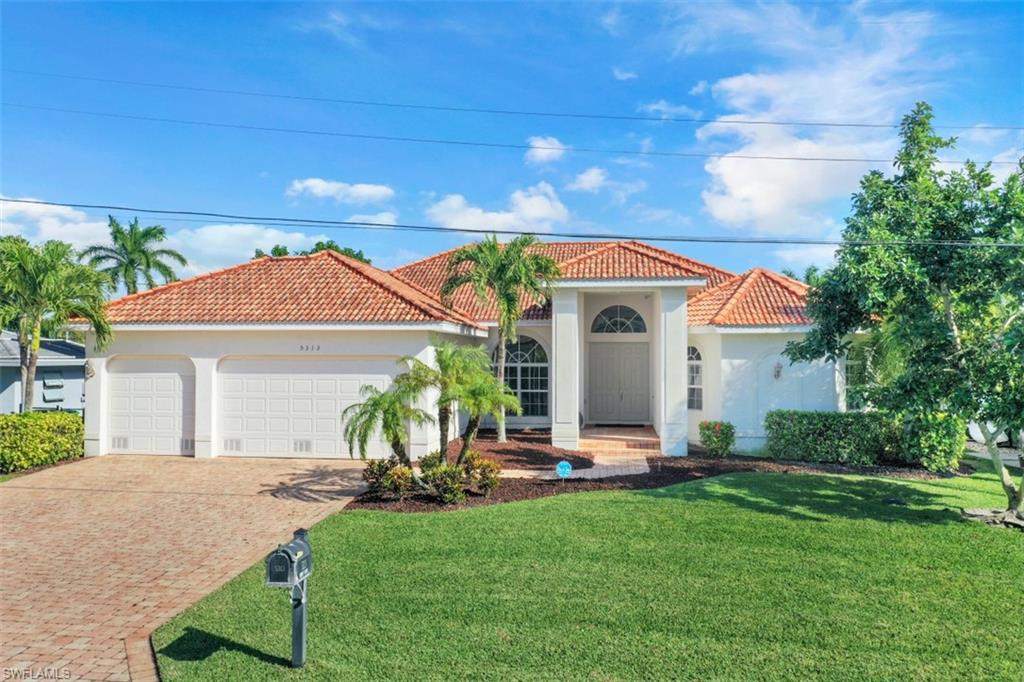 Feast your eyes on this incredible DIRECT ACCESS home located in the Cape Coral Yacht Club area. Take advantage of the best both land and water have to offer as this home is a few minute drive from some of Cape Coral's best shopping, dining and entertainment as well as a few minute boat ride to open water. NO BRIDGE ACCESS! This home offers nearly 2,700 square feet, 3 beds + Den, 2 1/2 baths, 3 car garage and is loaded with upgrades both inside and out. IMPACT RESISTANT WINDOWS AND SLIDERS!! The backyard is a waterfront oasis. Paver deck surrounds the infinity edge pool loaded with upgrades including sun shelf, solar AND electric heat, integrated spa and a combo swim up/walk up bar with umbrella shade. Composite deck dock provides tons of sitting area both in the sun and under a gazebo. Boat lift is canopy covered.  Pool bath  is located off back of home for convenience. Kitchen features 42" upper cabinets with crown molding, stainless steel appliances, granite counter tops, separate island, under cabinet lighting and a great view of the pool/water. This entire home is stays bright through natural light alone. Too many features to list. Take advantage of this home before it's gone!