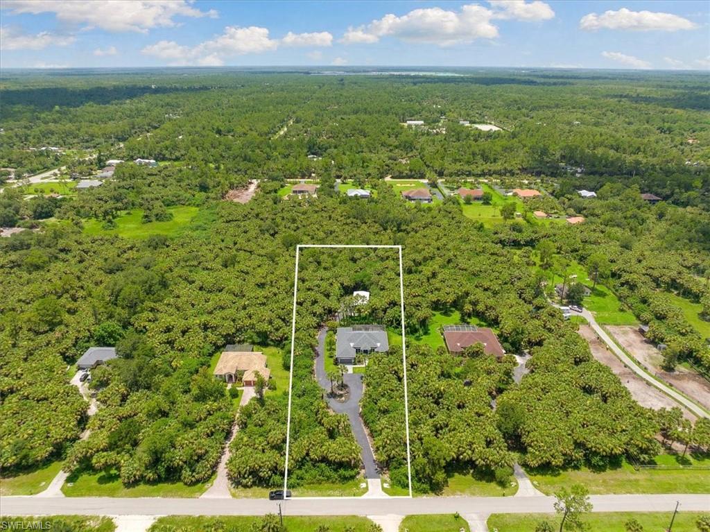 Behind the new gates of this quiet retreat, the worlds of chic contemporary aesthetic & resort style comfort come together in this gorgeous 3 bedroom plus den & 3 full bath, salt water &  heated pool home w/ all the bells & whistles with a 2018 Roof. Step in from the Florida sun into the living room w soaring vaulted ceiling & access to the backyard.  Off to your left is the formal dining area & gourmet chef's kitchen equipped w the highest quality appliances,granite, island, & views of the enclosed lanai & pool.  From the kitchen, enjoy entertaining in the great room w access to the back as well. The primary bedroom is expansive w views of the lanai from french windows, double vanity, & resort style shower.  The remaining bedrooms opposite the primary are large w plentiful closet space.  The laundry room gives new meaning to expansive with tons of storage, soaking slop sink, & added counter space.  The meticulous planning of the home carries out into the garage with epoxy flooring & plentiful storage.  A 1,250sq ft Workshop w new roof is ideal to furnish any project.  This home is nestled in Golden Gate’s coveted area, a stone’s throw away from all the action SWFL has to offer!