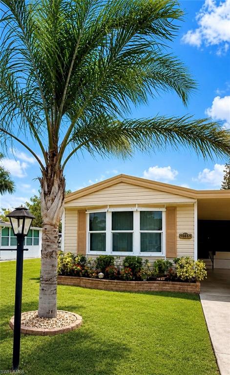 Embrace the ultimate Southwest Florida lifestyle in this recently listed 55+ community home. Located just a mile from the heart of historic Old Bonita Springs, you’ll be minutes away from local festivals, parks, and dining while enjoying a peaceful neighborhood retreat. A single wide home that lives like a double wide!  A tour is a must to appreciate the spaciousness of this home!  The home features vaulted ceilings throughout, updated flooring throughout, 2 spacious bedrooms along with 2 generous baths.  Primary bedroom also has huge walk in closet.  Living room is open to full sized kitchen with plentiful countertops and cabinetry.  There are multiple areas  in this home to consider for dining.  The four season Florida Room is perfection! Laundry inside the utility room off the Florida Room. Generous covered parking.  A sidewalk winds around the home to a rear patio for private relaxation overlooking a canal.  Quite a bit of storm protection has been added!  Bonita St James Village is an age restricted Co-Op community.  Cash purchase includes a Co-Op ownership share in Bonita St. James Village. Monthly HOA of just $95! Where else is paradise so affordable?! HOA fee covers a community pool, spa, community center, trash, lawn maintenance (inc mowing, edging, (2) tree maintenance) roads, fenced storage area and other common expenses. Minutes to dining, post office (.9 miles), library (1.8 miles), Bonita Beach (6.5 miles) and shopping. Come and experience the climate, history, culture and nature of paradise! Restrictions require one resident must be age 55 or above, the other may be age 45 or above. 118 homesites, approximately 1/3 occupied fulltime. Leasing w/restrictions. Pets w/restrictions.