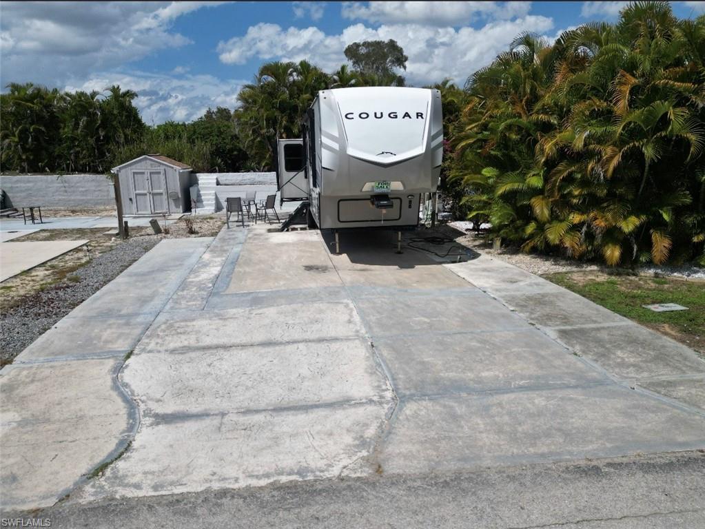 BUY ONE OR BUY BOTH! RARE SIDE-BY-SIDE LOT OPPORTUNITY! VACANT LOT READY FOR YOUR RV, PARK MODEL, OR MANUFACTURED HOME! This homesite can be purchased individually or together with the adjacent lot at 5024 White Sky Circle, creating one of the largest combined properties in America Outdoors.
This lot offers the flexibility to design your ideal Florida retreat. Whether you’re looking for extra outdoor living space, additional parking, room for entertaining, or a larger footprint with added privacy, opportunities like this are extremely rare. Purchase one lot or combine both for a truly unique setup that is difficult to find in the community.
Own your land outright with low HOA fees and low taxes in the highly desirable gated 55+ community of America Outdoors. Residents enjoy a newly renovated clubhouse, heated pool, hot tub, shuffleboard, bocce, and a full calendar of social activities.Conveniently located just minutes from Gulf beaches, shopping, dining, entertainment, CVS, Publix, and RSW International Airport. Don’t miss this opportunity to own one of the most versatile homesites in America Outdoors with the option to purchase the adjoining lot and create one of the largest combined properties in the community.