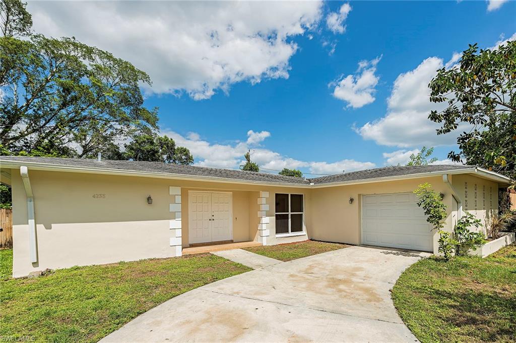 Welcome to this charming single-family home in Golden Gate City, conveniently located near main roads, shopping centers, schools, and less than 20 minutes to wonderful beaches and downtown Naples. The three-bedroom split floor plan accommodates family and guests. Updated kitchen offers brand new Whirlpool stainless steel appliances and granite countertops. Freshly painted interior and exterior in neutral colors, tile flooring throughout, new windows and updated bathrooms, brand new washer and dryer. Relax on your spacious lanai overlooking a yard with pool and spa. And best of all, your move-in ready home is truly maintenance-free.