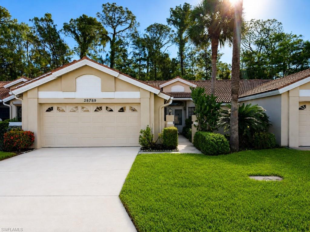 Exclusive Charter Golf Membership Included! Discover the perfect opportunity to enjoy the Hunters Ridge lifestyle in this spacious 2 bedroom, 2 bath attached villa home. Tucked away on a quiet street, this home welcomes you with a private courtyard entry and offers a desirable split bedroom floor plan, generous living and dining areas, and a large screened lanai overlooking a peaceful, private wooded setting. The spacious primary suite features a large walk-in closet and en-suite bath, while the guest bedroom provides comfort and privacy for family and friends. The bright eat-in kitchen offers ample cabinetry and storage, and the attached 2 car garage adds convenience and functionality. Priced to reflect its need for updating, this villa presents an outstanding opportunity to customize and make it your own while enjoying all that Hunters Ridge Golf & Country Club has to offer. Charter Golf Membership owners enjoy the unique flexibility of choosing golf or social membership privileges annually. Hunters Ridge is a Private Golf & Country Club, not a bundled community with only 420 golf members, no Chelsea system and our golf member enthusiasts can play the course as often as they like! Hunters Ridge is very friendly, casual, and offers a large variety of social activities. Only 6 miles from Barefoot Beach Preserve! Just minutes to the best shopping, dining, entertainment, and the RSW Airport. 18 hole championship golf course, golf simulators, large community swimming pool with food & beverage service, community center, fitness center, clubhouse, beautiful dining room and grill room, poolside cafe, tennis courts, pickleball courts and much more! Adding to the lifestyle our Community Center is opening soon with expanded fitness and wellness amenities! This exciting enhancement will elevate daily living, increase home values, and truly bring resort style wellness to your doorstep.