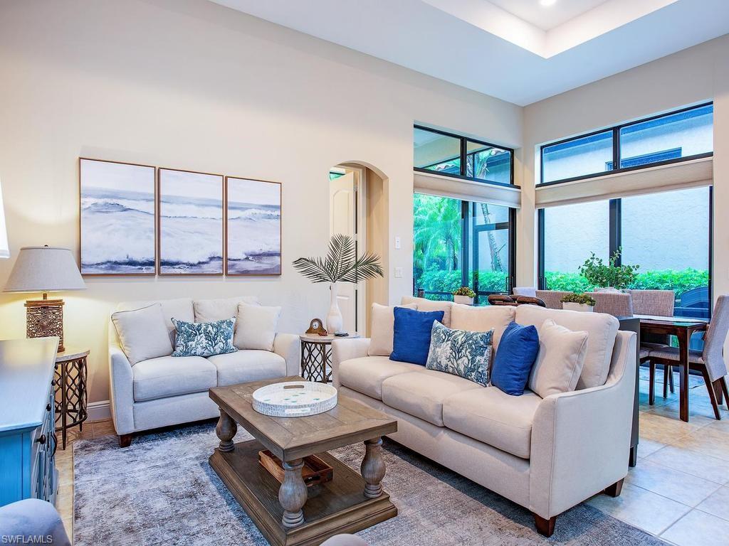 Completely reimagined and beautifully renovated, this exceptional San Sebastian floor plan in Cordoba at Lely Resort offers the perfect blend of sophisticated design, effortless indoor-outdoor living, and the privacy today's buyers are searching for. 
From the moment you step inside, soaring tray ceilings, expansive transom windows, and an open-concept layout create a bright, inviting atmosphere. The stunning custom kitchen serves as the centerpiece of the home, featuring full-height shaker cabinetry, quartz countertops, designer tile backsplash, stainless steel appliances, oversized island with seating, upgraded fixtures, and statement woven pendant lighting.
The great room and dining area flow seamlessly to the screened lanai where lush tropical preserve views create an incredibly private backdrop for morning coffee or evening entertaining.
The spacious owner's suite offers direct lanai access and has been thoughtfully updated with dual quartz vanities, designer cabinetry, modern lighting, an oversized walk-in shower, generous walk-in closet, and refined finishes throughout.
Additional highlights include updated baths, luxury lighting fixtures, updated cabinetry throughout, quartz counters in every bathroom, plantation shutters, neutral designer finishes, spacious laundry room, oversized two-car garage, and an ideal split-bedroom floor plan.
Located within the prestigious gated community of Cordoba at Lely Resort, residents enjoy beautifully maintained grounds, low-maintenance living, and close proximity to the Flamingo and Mustang public golf courses, with optional private membership at The Classics and IMMEDIATE ACCESS to the PLAYERS CLUB AND SPA.
This is not simply another resale—it is a thoughtfully updated home where every major living space has been elevated for today's luxury buyer.