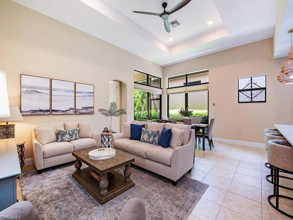 Completely reimagined and beautifully renovated, this exceptional San Sebastian floor plan in Cordoba at Lely Resort offers the perfect blend of sophisticated design, effortless indoor-outdoor living, and the privacy today's buyers are searching for. 
From the moment you step inside, soaring tray ceilings, expansive transom windows, and an open-concept layout create a bright, inviting atmosphere. The stunning custom kitchen serves as the centerpiece of the home, featuring full-height shaker cabinetry, quartz countertops, designer tile backsplash, stainless steel appliances, oversized island with seating, upgraded fixtures, and statement woven pendant lighting.
The great room and dining area flow seamlessly to the screened lanai where lush tropical preserve views create an incredibly private backdrop for morning coffee or evening entertaining.
The spacious owner's suite offers direct lanai access and has been thoughtfully updated with dual quartz vanities, designer cabinetry, modern lighting, an oversized walk-in shower, generous walk-in closet, and refined finishes throughout.
Additional highlights include updated baths, luxury lighting fixtures, updated cabinetry throughout, quartz counters in every bathroom, plantation shutters, neutral designer finishes, spacious laundry room, oversized two-car garage, and an ideal split-bedroom floor plan.
Located within the prestigious gated community of Cordoba at Lely Resort, residents enjoy beautifully maintained grounds, low-maintenance living, and close proximity to the Flamingo and Mustang public golf courses, with optional private membership at The Classics and IMMEDIATE ACCESS to the PLAYERS CLUB AND SPA.
This is not simply another resale—it is a thoughtfully updated home where every major living space has been elevated for today's luxury buyer.