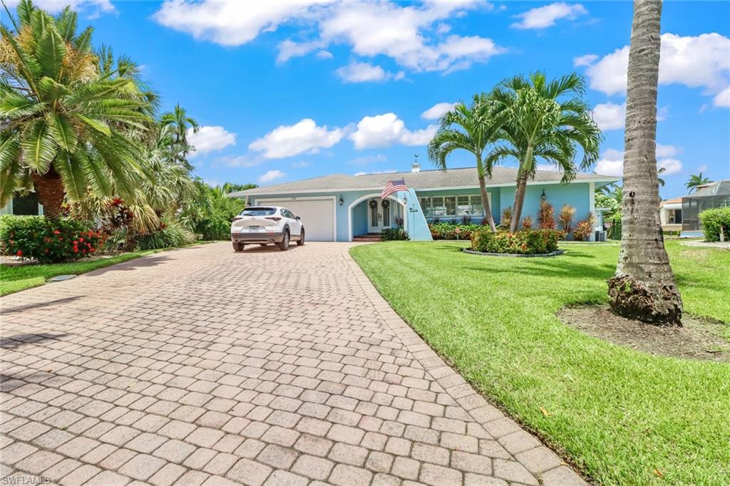 Spend time in beautiful Naples, FL in an equally beautiful single-family home situated on one of the deepest water canals in the coveted Royal Harbor neighborhood. This stunning home features four bedrooms, three full bathrooms, and one-half bathroom, along with an open layout displaying the kitchen island as a focal point surrounded by the dining room and sitting area. Spend your days splashing around in the saltwater pool, relaxing in the large backyard with 200ft of water frontage, or prepping your boat (up to 45 ft!) and jet skis for a day out on the Gulf of Mexico, then relax your evenings away in the award-winning restaurants, stylish boutiques, and entertaining hot spots. Plan for new construction of an estate sized home or live in wonderfully remodeled residence. Either way…benefit from a new seawall (2018) with 50 amp service sitting on .33 acres. The single-family home is located just moments from 5th Avenue South, 3rd Street S, Tin City, Bayfront Place, Naples Bay Resort, and the famous Naples Pier. This is a home you do not want to let pass you by.