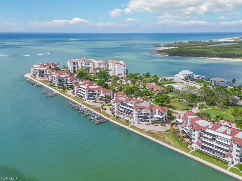 Experience elevated coastal living in this expansive waterfront Isles of Capri condo, showcasing breathtaking views of the Marco River, Johnson Bay, and the Gulf. Offering approximately 1,750 square feet of beautifully updated living space, this coastal-chic residence has been thoughtfully redesigned to blend sophisticated contemporary style with the laid-back luxury of Southwest Florida. An open and inviting layout, abundant natural light, and spectacular water vistas create the perfect setting for both everyday living and unforgettable sunsets.

From the moment you enter, you’re welcomed by soaring vaulted ceilings, abundant natural light, and an open-concept layout designed for both effortless entertaining and everyday comfort. The expansive living and dining areas flow seamlessly into a spectacular lanai retreat where panoramic waterfront views create the perfect backdrop for morning coffee, sunset cocktails, or peaceful evenings overlooking the water.

The designer-inspired interior features upscale finishes throughout, a beautifully updated contemporary kitchen, spacious bedrooms, walk-in closets, and thoughtfully curated details that evoke timeless coastal luxury. Every space has been crafted to maximize comfort, style, and the incredible surrounding scenery.

Ideally located just minutes from the world-renowned beaches, boating, dining, and shopping of Marco Island, this exceptional residence offers the perfect balance of luxury, tranquility, and convenience. Whether you’re searching for a full-time waterfront residence, an elegant seasonal escape, or a premier investment opportunity, this rare coastal gem delivers the ultimate Florida lifestyle.