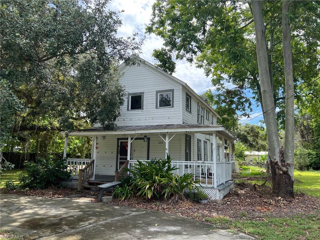 Discover the charm and potential of this delightful two-story home nestled within LaBelle's city limits. This well-positioned property offers three comfortable bedrooms and two full bathrooms across 1,642 square feet of living space, creating an ideal canvas for your personal touch and renovation dreams. The home sits proudly on an oversized .64+/- acre lot that practically begs for your creative outdoor vision. Whether you're dreaming of expansive gardens, entertaining spaces, or simply room for the kids and pets to roam, this generous lot size delivers possibilities in abundance. The welcoming front porch invites morning coffee moments, while the rear porch provides the perfect backdrop for evening relaxation. Built with durability in mind, the metal roof offers peace of mind and long-term value. The convenient location near State Road 80 ensures easy access to surrounding areas while maintaining the peaceful residential atmosphere LaBelle residents cherish. This property represents an excellent opportunity for buyers seeking renovation potential in an established community. The solid foundation, generous lot, and desirable location create the perfect combination for those ready to invest in their vision.