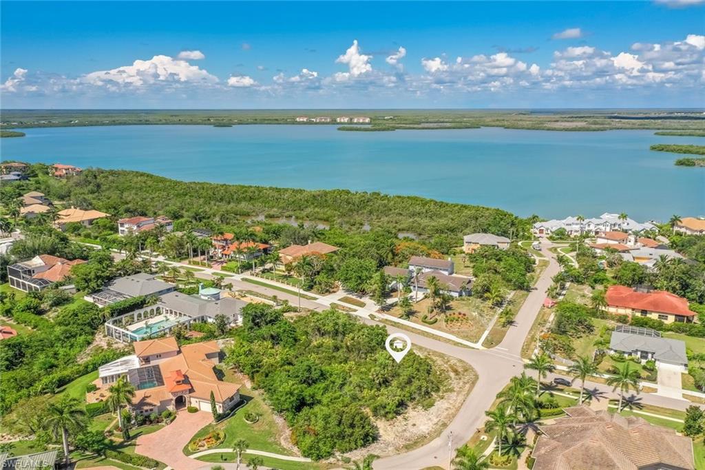 High and dry lot located in Marco Island premier estate neighborhood. Surrounded by beautiful homes this large corner lot offers over a ½ acre to build a luxury home. Skyline and sunset views possible from 2nd floor to afford some of the most interesting views on the island. Sunny exposure for lots of light. Survey on file.