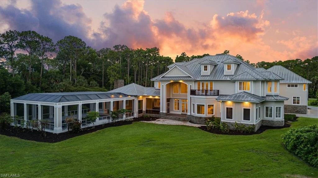 One or more photo(s) has been virtually staged, AI generated or rendered.  A Landmark Estate Offering in the Heart of Naples — Nearly 22,000 Square Feet of Exceptional Indoor and Outdoor Living on 5 Private Acres

Presenting one of the most remarkable estate properties ever offered in Naples. Privately positioned on an expansive five-acre homesite along prestigious Coach House Lane, this extraordinary three-story residence encompasses nearly 13,700 square feet under air and just under 22,000 square feet of total living space, delivering a level of scale, privacy, and luxury rarely found in Southwest Florida.

Nestled near the end of a quiet cul-de-sac within one of Naples’ most discreet and sought-after residential enclaves, the estate offers a serene and secluded setting while remaining just minutes from world-class shopping, dining, golf, and Gulf beaches.

Designed to accommodate both intimate family living and grand-scale entertaining, the residence features eight spacious bedrooms, six full baths, and two half baths. Exceptional amenities include a private elevator, butler’s pantry, six-car garage with vehicle lift, state-of-the-art appliances, dual laundry rooms, media room, multiple sunrooms, and expansive living and gathering spaces filled with natural light. Distinctive specialty rooms, including a tranquil orchid conservatory and dedicated art studio, provide unique spaces for creativity, relaxation, and personal pursuits.

The outdoor environment is equally impressive. A spectacular resort-style covered pool serves as the centerpiece of an expansive entertainment pavilion designed for year-round enjoyment. Complete with a fully equipped outdoor kitchen, wood-burning fireplace, generous covered lounge areas, and multiple dining spaces, the setting is ideal for hosting everything from casual family gatherings to elegant private events.

The sprawling grounds offer endless possibilities, with abundant open space creating an unparalleled sense of privacy and opportunity rarely available within Naples. Whether envisioned as a private family compound, a luxury retreat, or an entertainer’s paradise, this exceptional property delivers a lifestyle beyond comparison.

Rarely does an estate of this magnitude, quality, and location become available. Offering an extraordinary blend of sophistication, privacy, and resort-inspired living, this is truly a once-in-a-generation opportunity in the heart of Naples.