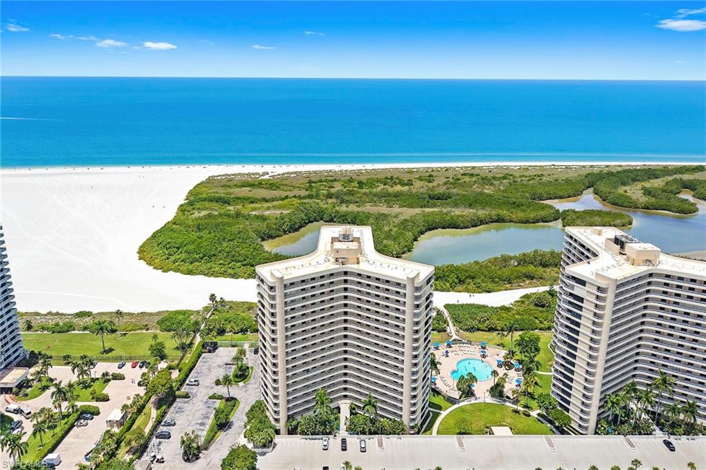 This 2nd floor condo has spectacular beach, palm tree, and Gulf views. Southern exposure sun hits your terrace which can be entered by the living room, and both bedrooms. Fully remodeled in 2023!  Interior features include 2 bedrooms and 2 bathrooms, master bedroom has a walk in closet, and bathroom has 2 sinks. Wood cabinetry in kitchen with new stainless steel appliances. New furniture and tastefully decorated. Being sold furnished. All new Hurricane Impact glass sliders installed in 2020. Luxury linoleum flooring throughout the condo. Super easy access to this unit via the nearby stairs, or elevator. Across the hallway is an extra storage locker with plenty of room to store beach stuff. Enjoy the resort lifestyle at South Seas Towers. Weekly rental income opportunities. Amenities included a heated pool, large sunning deck with chickee huts, exercise room, covered parking garage, manger and security on site, guard at gate, pickleball and tennis courts, bocce ball, shuffle board, putting green, walking paths, bbq grills, plus boat slips available for lease.