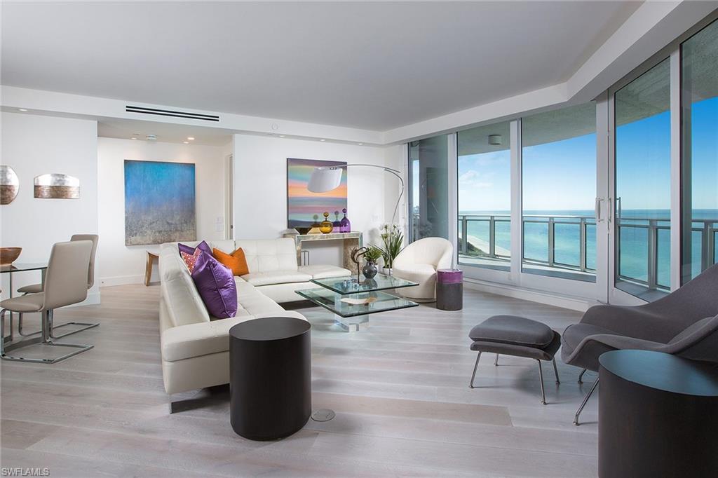 Offering a transitional design with modern flair, this stunning 11th floor residence can only be outdone by its spectacular panoramic Gulf views. Enter through the simplistic yet elegant foyer and be immediately drawn through the floor to ceiling glass to the wrap around open balcony. Sophisticated styling and sleek finishes are found throughout and include, smoke grey French wide plank floors, oversized shaker baseboards and trim, single pane doors and glass built-ins. An exquisite master and en-suite are connected through a fogged glass sliding barn door, where inside you will find honed marble mosaic tile, Lacava free standing soaking tub, glass encased shower and Ceasarstone countertops. The Brighton also offers first class amenities such as lap pool, spa, fitness area and three guest suites while still having access to all Pelican Bay and Bay Colony is renowned for.