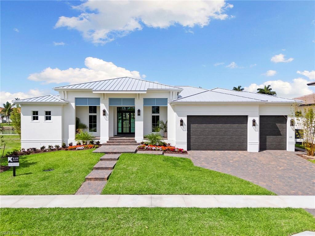 Just completed! New construction waterfront residence on Marco Island with direct, no-bridge boating access and a new seawall. This thoughtfully designed custom home delivers an all-ensuite design, including two primary suites, three bedrooms all with walk-in closets, a den, and a full-size three-car garage, an uncommon feature on Marco Island.  THIS HOME REPRESENTS THE BEST VALUE FOR A NEW WATERFRONT HOME WITH NO BRIDGES TO ACCESS!!

Pocketing sliding doors seamlessly open a light-filled great room to expansive outdoor living, with southwest exposure creating an inviting setting for both daily living and entertaining. The outdoor environment is designed for hosting and entertaining, featuring a custom pool and spa, a clear glass fence to preserve water views, and large outdoor gathering areas with a custom outdoor kitchen.

This professionally curated interior furniture package by Michael Biondo Design presents a cohesive, elevated feel, befitting of this high-end custom home and is available for purchase.  Other features include engineered wood flooring throughout.  The bespoke kitchen includes a Thermador appliance package, mother of pearl backsplash, a dramatic waterfall 10' island, and a butler's pantry with sink and dishwasher and storage galore. 

Designed for buyers seeking the benefits of new construction without the time or uncertainty of building, Kaye Lifestyle Homes, voted Builder of the Year for Collier County and for the State of Florida is proud to present a rare combination of location, quality, and intelligent market positioning, with no truly comparable offerings currently available. Call for your private showing.